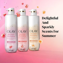 Three Olay intensely hydrating body wash bottles with pumps, limited edition strawberry fizz