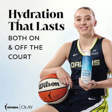 Olay body wash bottle in blue with pump held by athlete, Victory Vibes Vanilla