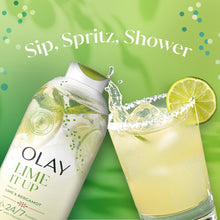 Olay Lime It Up body wash bottle beside lime drink with splash