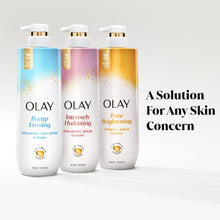 OLAY body wash bottles with gold pumps, multiple labeled bottles