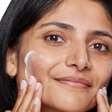 Retinol night moisturizer applied to face, smooth cream layer