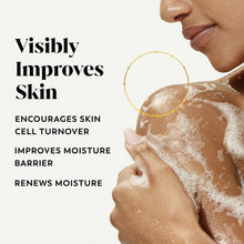 Body wash foam on bare shoulder and neck, suds visible on skin