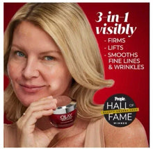 Facial moisturizer jar held near cheek; woman portrait showcasing OLAY cream