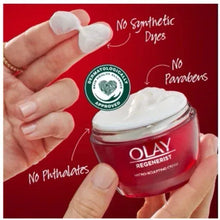 OLAY Regenerist cream jar in hands with visible dollops of cream