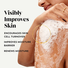 White body wash lather on shoulder and arm, hands applying foam