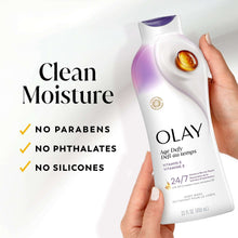OLAY Age Defy body wash bottle held in hand, white and purple