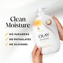 Olay body wash bottle held in hand with Clean Moisture claims, no parabens