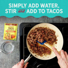 Old El Paso taco seasoning mix packet and cooked beef in frying pan