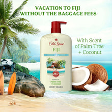 Fiji body wash bottle with red pump beside coconut and tropical beach items.