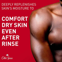 Body wash bottle near man's shoulder with water droplets and foam, comfort for dry skin.