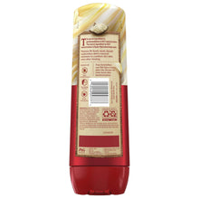Body wash bottle back view with beige information label and red bottom section.