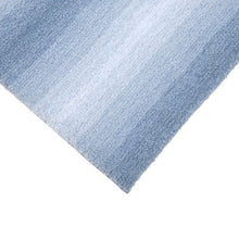 Blue ombre bath mat with dense soft pile and subtle horizontal gradient
