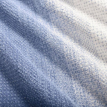 Blue and cream ombre bath towel fabric texture, waffle weave close-up