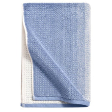 Blue ombre bath towel with cream reverse, folded corner detail