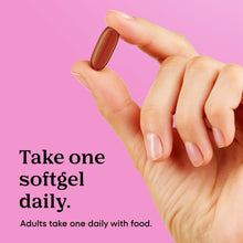 Softgel held in a hand for daily prenatal multivitamin