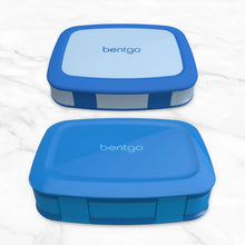 Two blue Bentgo lunch boxes with closed lids and snap latches