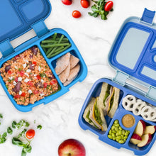 Blue lunch boxes open with divided compartments filled with snacks and sandwiches