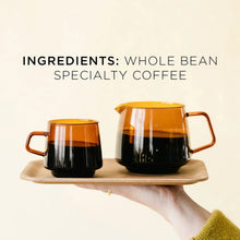 Coffee carafe and cups with 'Ingredients: whole bean specialty coffee' text