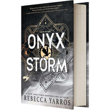 Hardcover book set, front cover with dark emblem artwork and visible spine on right