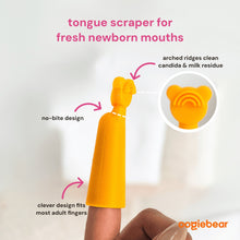 Orange silicone tongue scraper for newborns, finger-held with ridged curved tip