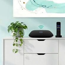 Wireless home phone base and cordless handset on charging cradle