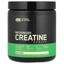 Creatine powder container, black lid and dark jar with green unflavored label