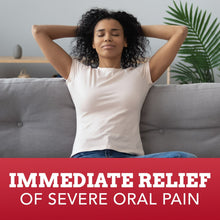 Person relaxing on couch with large text overlay reading “Immediate relief of severe oral pain”