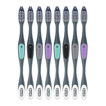 Eight soft-bristle toothbrushes with multicolored bristle heads on dark handles