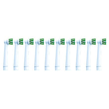 Oral-B CrossAction replacement brush heads with green bristles on white stems
