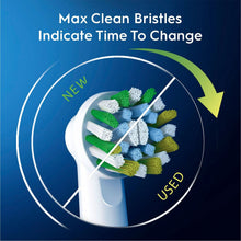Toothbrush replacement head with green and blue bristles in a max-clean pattern