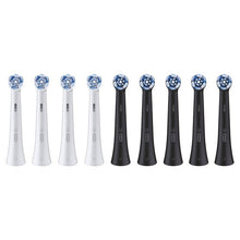 Nine replacement toothbrush heads with blue bristle tips, four white and five black handles.
