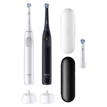 Oral-B iO Series 2 rechargeable toothbrushes, white and black with travel cases and heads