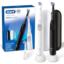 Electric toothbrush twin pack with white and black handles and 2 brush heads