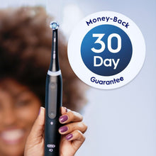 Oral-B iO replacement brush head held in hand with 30-day money-back badge