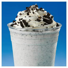 Cookies-and-cream milkshake with crushed Oreo cookie topping in a cup