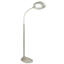 LED magnifier floor lamp with tall pole, round lens head, and round base