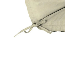 Beige cushion ties and strap loops on the corner