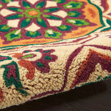 Ivory doormat edge close-up showing textured woven fibers and burgundy border