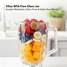 Retro smoothie blender with clear 50 oz glass jar and fruit pieces inside