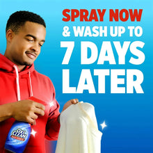 Laundry stain remover spray bottle with red nozzle and blue label
