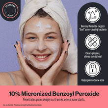 Acne face wash skincare shown on face with white foam under a towel.