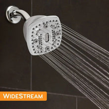 Square fixed shower head with white spray face and chrome connector, spraying wide fan water streams
