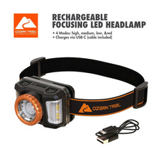 Rechargeable LED headlamp with black strap, orange accents, and USB charging cable