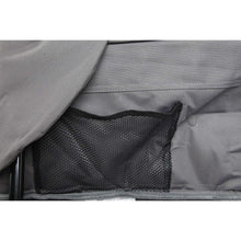Close-up of gray chair fabric with black mesh panel and stitched seams
