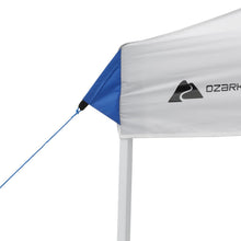 White canopy top with Ozark logo on blue corner panel and securing rope