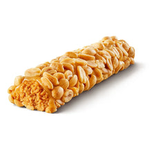 Peanut caramel candy bar in close-up with textured topping and golden color