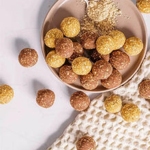 Roasted peanut powder coated bite-size snack balls in a bowl