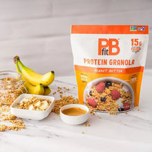 Protein granola bag with banana and small bowls of granola and peanut butter
