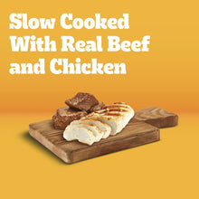 Slow-cooked dog food with real beef and chicken, shown as cooked chunks on a board.