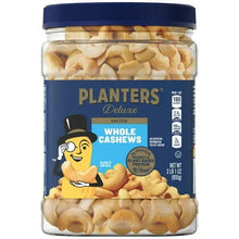 Salted whole cashews in a clear plastic jar with a blue lid